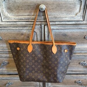 Louis Vuitton Brown and Tan Neverfull Tote.  Slight wear, missing cinch straps.